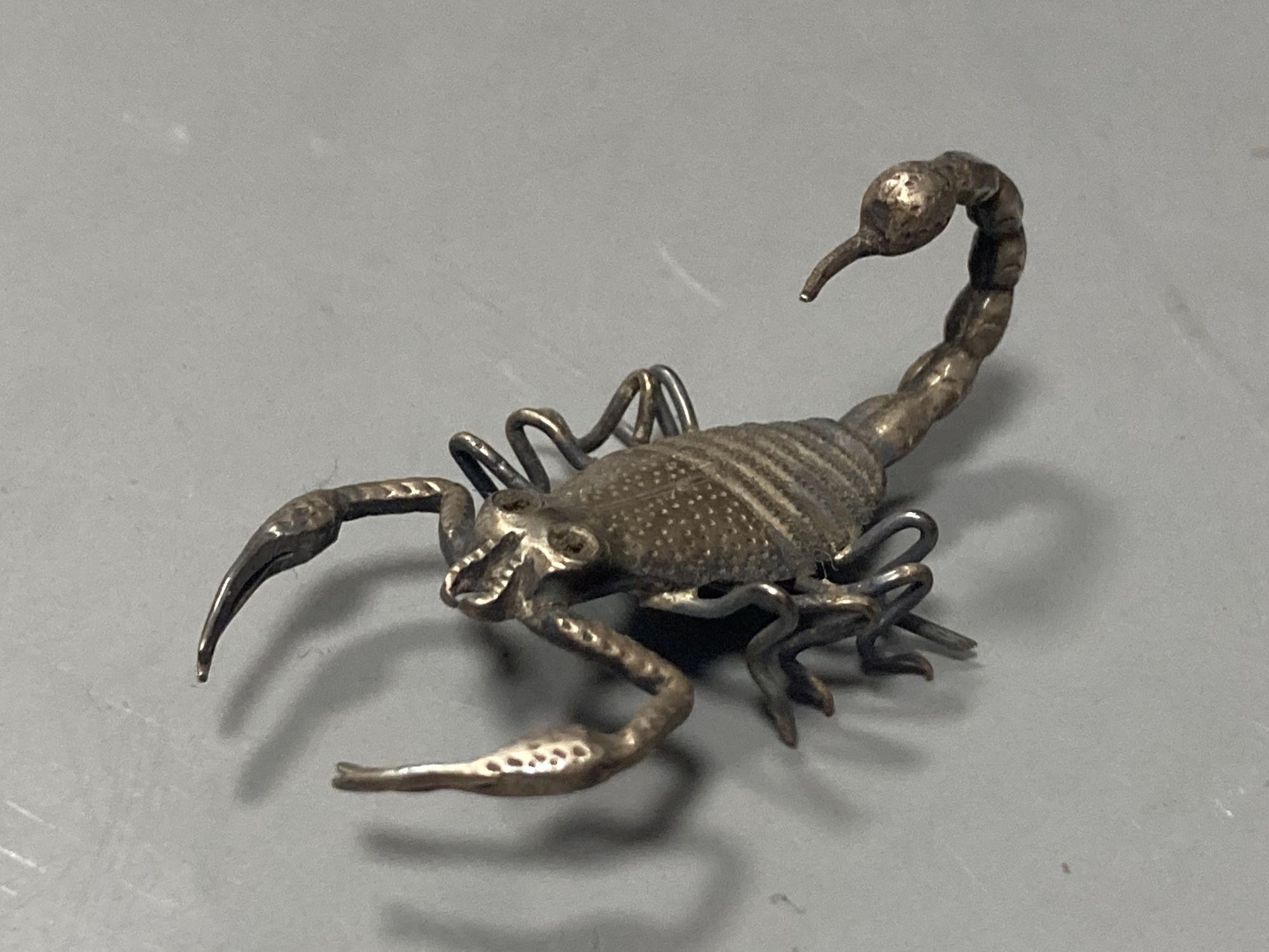 Five Indian? white metal miniature models of insects etc. including lizards, centipede and a scorpion, largest 87mm.